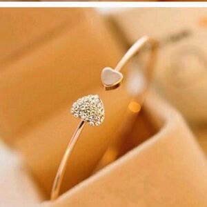 Bracelet DOUBLE HEARTS of CZ and gold tone.